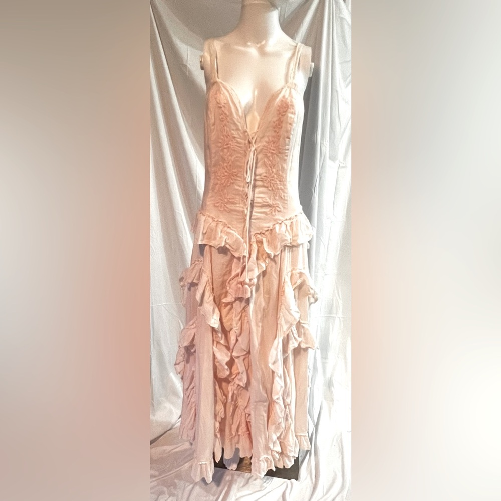 Peach embroidered ruffled summer dress. Very light and flow. A very fun dress.